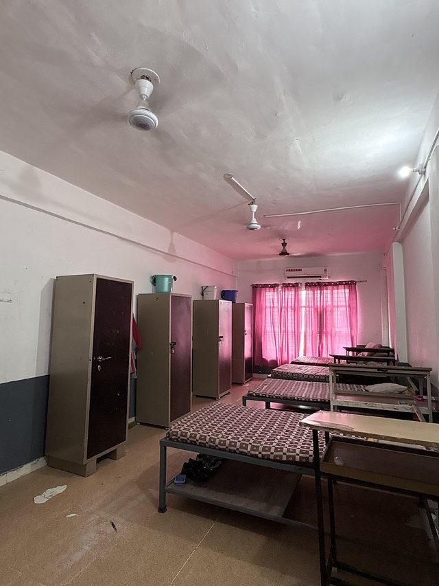 Hostel room with beds, lockers and storage