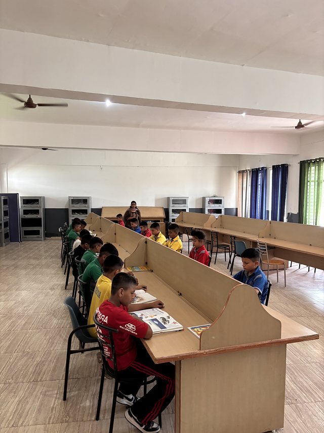 The school library with shelving and reading carrels