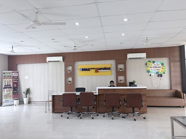 The school reception desk with signage and seating
