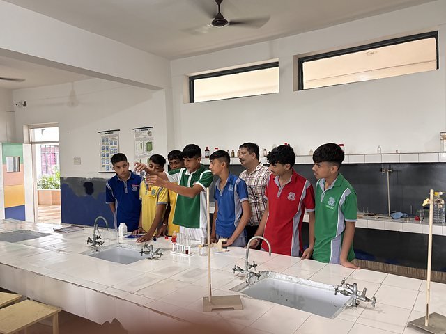 The full width of the science laboratory with students along the bench